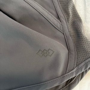 Grey. Lined. Has pockets. Drawstring.